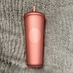 Light pink studded Starbucks cup
